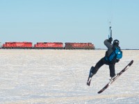 Kite Skiing!  This kite skier catches some air as CP 2N08 heads south through Albatross with two SD60 "pushers" lifted at Craven.