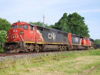 CN 2438 leads CN 421 through Clifton, nearing their destination at Port Robinson.  CN was running management training trains from Mac Yard to Paris and return at this time, 907 westbound and 908 eastbound.  CN 2438 and CN 2420 were assigned to the train (among others), however on this Saturday CN must have been short of power at Mac Yard and stole 2438 for a 421/422 run Saturday/Sunday.  I have photographs of 2438 on 907 the week before and the week after.  The second order of C40-8M (2430-2454) has many more remaining in service compared to the first order; only three have been sold for scrap by my count (as of 02/2021).  Units in the second order differ in appearance from the first order because they arrived in CN North America paint instead of "zebra stripes", have one less marker light (no green), and the bell was relocated.  The question is where?  I can't see it in any of my photos.  I assume it's under the frame, behind the front pilot?  2430-2454 look too bare without the bell mounted on the front of the cab.   