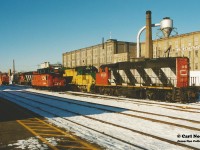 During the first couple months of the Goderich-Exeter Railway takeover of the CN Guelph Subdivision and related trackage, power-short GEXR had leased CN 9633, CN 9643 and CN 9661. On an early winter morning, all three CN units are seen along with NECR 9539 and GEXR 4046 in front of the Kitchener station along with GEXR's recently acquired former CN caboose.  