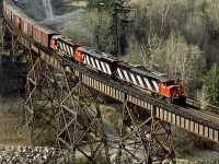 Eastbound general freight crosses Anderson Creek just west of crew change point of Boston Bar in the Fraser Canyon