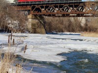 Last weeks deep freeze has finally began to take its grip off the frozen Credit River. While there is little signs of life other than some animal footprints in the snow, CP T14 certainly adds a splash of colour to the dormant landscape as somewhat unique former GP40X 4522 leads local T14 home to West Toronto.