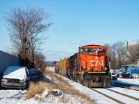 The CN 0700 Yard Job heads eastbound on the N&NW Spur with cars for Parkdale Warehousing, Parkland, and Platinum Rail.