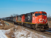 After dropping cars for CP (cars for Innophos in Port Maitland and Washington Mills in Niagara Falls) and the now infamous JLCX 3502 at CN Southern Yard, CN L562 continues onwards through CN Yager as they head towards the CP Hamilton Sub with 23 tanks in tow for Trillium to be interchanged at Feeder Yard. CN's lift at Feeder had a bunch of cars not for them mixed in with it (per radio conversation overheard), so they ended up only taking two cars back with them on the return trip - the two-bay NS hoppers that Trillium takes to Vesuvius in Welland. They would also work Southern Yard on the return to Port Rob, grabbing a few loaded pipe cars from Welded Tube. <br><br>562 is most often a two-unit train (though in the minority of times it does run as one), with power coming off of the day's 421 (in this case CN 5755 was trailing third on the day's 421) and/or whatever is straggling around in Port Rob (in this case CN 2403).