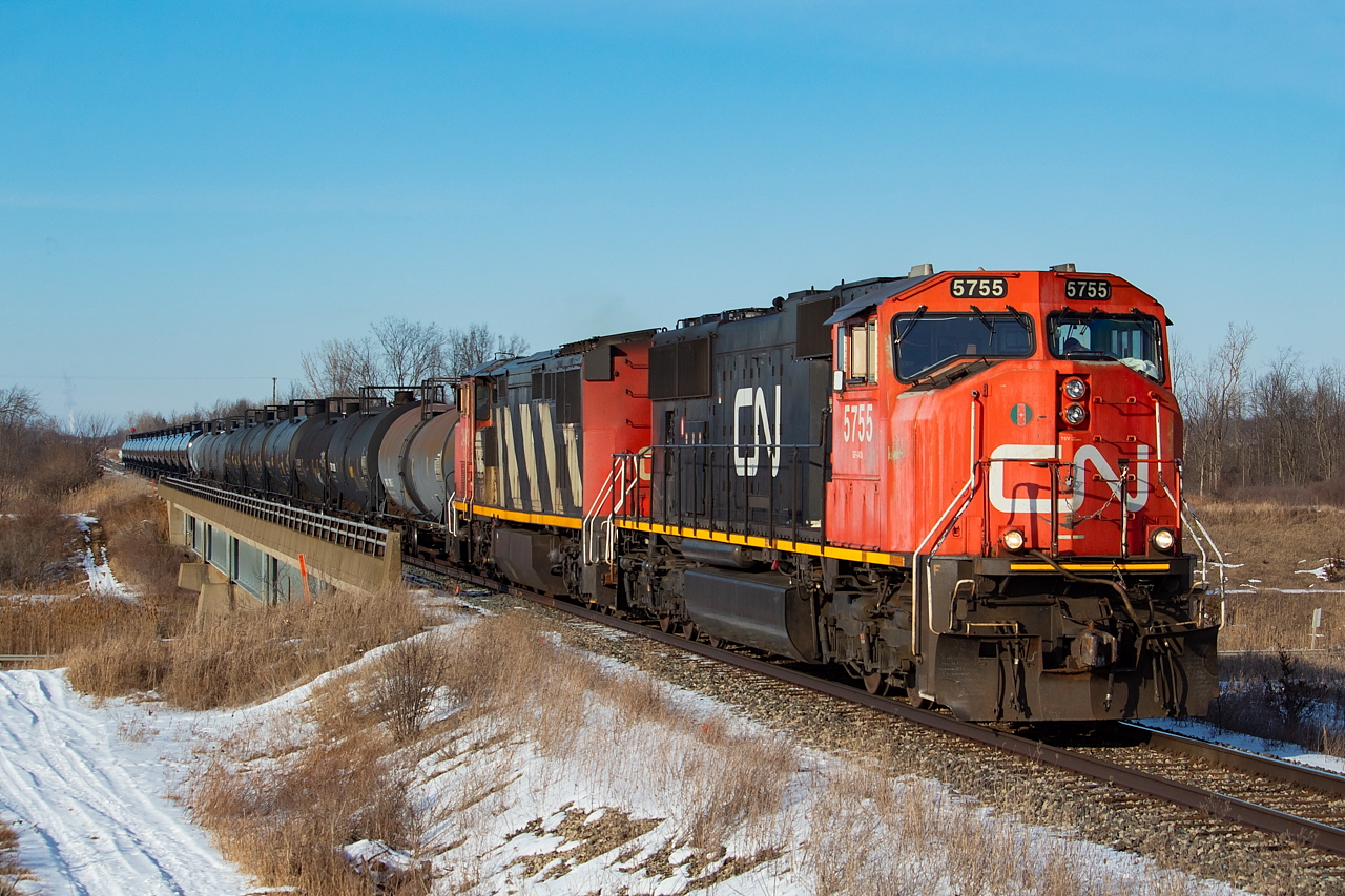 After dropping cars for CP (cars for Innophos in Port Maitland and Washington Mills in Niagara Falls) and the now infamous JLCX 3502 at CN Southern Yard, CN L562 continues onwards through CN Yager as they head towards the CP Hamilton Sub with 23 tanks in tow for Trillium to be interchanged at Feeder Yard. CN's lift at Feeder had a bunch of cars not for them mixed in with it (per radio conversation overheard), so they ended up only taking two cars back with them on the return trip - the two-bay NS hoppers that Trillium takes to Vesuvius in Welland. They would also work Southern Yard on the return to Port Rob, grabbing a few loaded pipe cars from Welded Tube. 562 is most often a two-unit train (though in the minority of times it does run as one), with power coming off of the day's 421 (in this case CN 5755 was trailing third on the day's 421) and/or whatever is straggling around in Port Rob (in this case CN 2403).