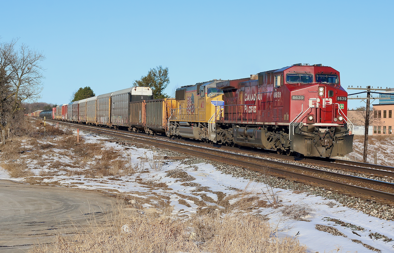 A bitter winter chill is in the air but at least the sky is clear as CP 234 rolls past the removed bad order track at Meadowvale. The short stub was built to hold any bad order cars caught by the detector at mile 25, but years ago was deemed unneeded. Trailing unit UP 4101 is no stranger to CP rails and has made a few trips around Southern Ontario in the past few days.