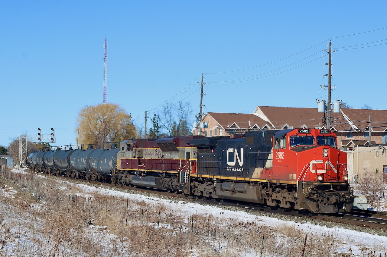 Certainly not a set of power I figured I would see passing through Streetsville. CP train 244 with over 10000 feet of train behind the power rolls eastbound with a CN Dash-9 and CP SD70ACU for motive power. It was a busy few hours with 246 lit behind and 247 not far behind 244.