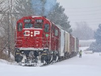 Streetsville has been turned into a winter wonderland as local T14 negotiates the snow covered old Owen Sound subdivision just north of the yard in order to run around their train. While it appeared they were waiting for the OBRY to arrive that plan appeared to change with no sign of the shortline arriving. While most of the hoppers on the train are for an industry on the CANPA sub. mechanical issues with the motive power changed the days plans, and after Streetsville they simply headed for home.  