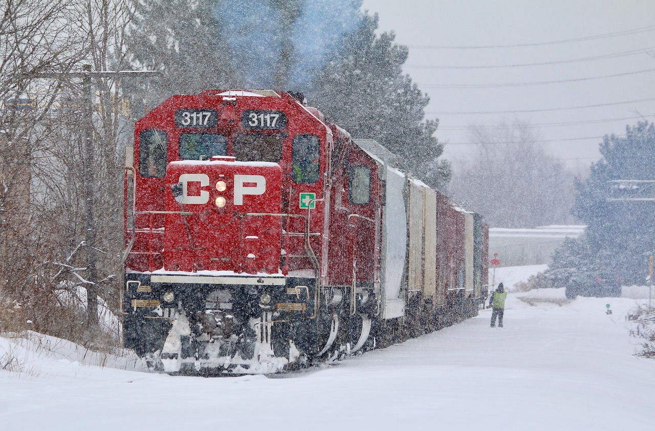 Streetsville has been turned into a winter wonderland as local T14 negotiates the snow covered old Owen Sound subdivision just north of the yard in order to run around their train. While it appeared they were waiting for the OBRY to arrive that plan appeared to change with no sign of the shortline arriving. While most of the hoppers on the train are for an industry on the CANPA sub. mechanical issues with the motive power changed the days plans, and after Streetsville they simply headed for home.