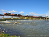 The Hagersville sub isn't the most scenic railway out there, but it does have its moments - Caledonia is by far the most scenic location and a must stop for any photographer. So not long after CN took the line back I took some time to follow 580 on a warm October day, so warm that the crew had the air conditioning full blast. This lashup was almost a complete return to 1997 again, save for the website on the middle unit. <br><br>While the Hagersville sub has been shut down about 5 months now, rumours are rife it's about to start up again. I'm also told they had a similar shutdown in 2006 for 3 months.

