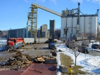 And here's the scene at the harbour as cleanup continues, Goderich Elevator & Transit company is in the background, this was the CPR side of the harbour and a loop track was situated where I am standing (existing road roughly outlines where it was) to get over to the CPR station, turntable and other facilities. I doubt engines have been seen this far since CP got rid of the line in 1988.