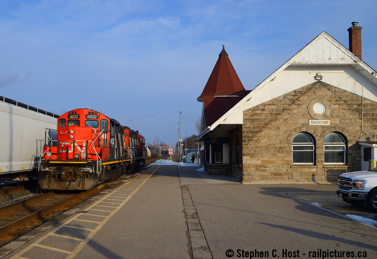 A "Teddy Bear Extra" operating on the Guelph sub - what does this mean? A term I've heard on CN a few times mostly in Sarnia, usually consisting of trainees learning how to railroad in the yard. In this case it was actually a qualification run for card carrying crews to become familiar with the Acton Grade on the Guelph sub mainline. There were a couple runs dedicated to this in January where L540 only ran back and forth to Georgetown from Guelph to cover the number of trips to help qualify a crew member. Running Kitchener to Georgetown, the crew ran around the train at the station, then back to Guelph, entire train around the wye, and back again to Georgetown and repeat until they ran out of time to get out of the way for VIA 87, returning to Kitchener. No work performed. Nothing.There were a couple occasions that L540 after working Canwel in Acton, would do the run around move in Georgetown, presumably a way to kill 2 birds with one shot.

Either way, a GP9 at the 1858 built Georgetown Station with the sun out on an otherwise cloudy day was a nice treat, and this is one of my favourite area stations. Georgetown was one of my favourite places to visit as a kid.