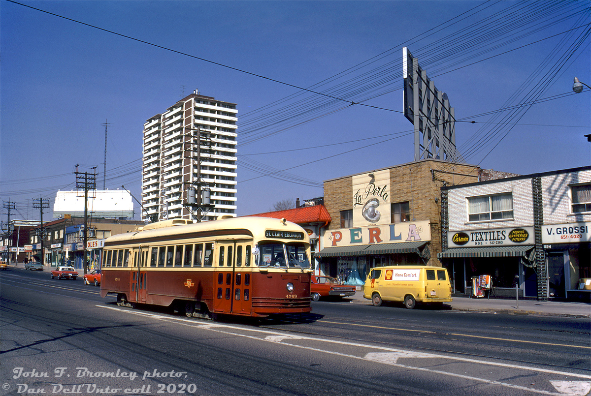 TTC 4769, one of the A14-class ex-Kansas City (Missouri) PCC's acquired secondhand, heads eastbound on St. Clair Avenue approaching Winona Drive in April of 1973, passing some storefronts including Coles (books) and La Perla (898 St. Clair Ave. W), Carmen Textiles, Darrigo's Food Market (behind the PCC), and a yellow Shell van (home heating fuels?). La Perla survived into the 2000's as a drapery store, before other uses took over the space. The store and that corner block at St. Clair & Alberta were demolished for redevelopment into condos a few years back (the 900 Saint Clair West development).

The ex-Kansas City PCC's (TTC A14-class 4750-4779, built by St. Louis Car Co. in 1946/47, acq. 1957) were the last PCC cars acquired by the TTC, but had suffered from lackluster maintenance at their previous owner. They ended up being the first of the secondhand cars to be retired or sold off. Most were resold to SEPTA (Philadelphia) and MUNI (San Francisco) later in the decade for continued service. Car 4769 became MUNI 1185, but reportedly never ran in service. One car sold to MUNI, car 1190 (ex-TTC 4752), managed to find its way back to Kansas City, and was restored and put on display as KCPS 551.

John F. Bromley photo, Dan Dell'Unto collection slide.