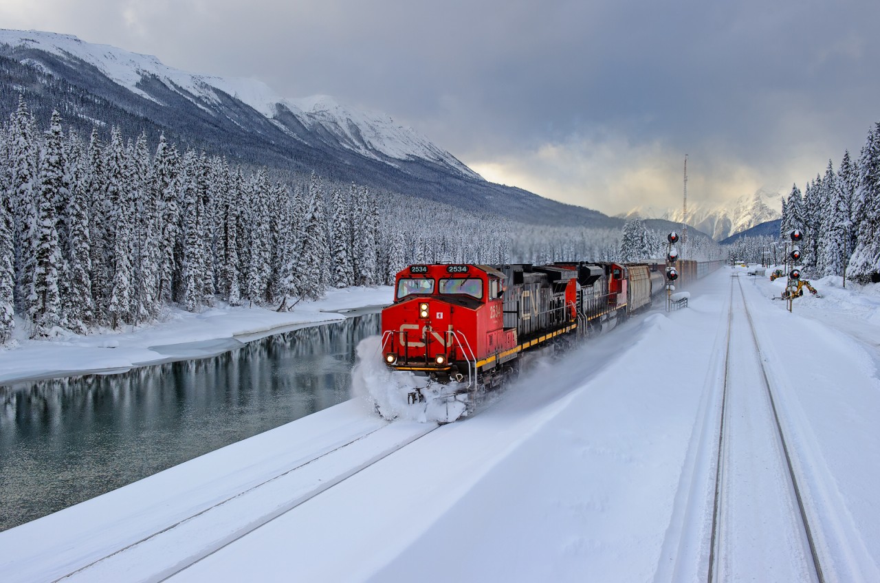 Prince George-Edmonton train M348 kicks up some freshly fallen powder at Redpass, BC.