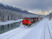 Prince George-Edmonton train M348 kicks up some freshly fallen powder at Redpass, BC.