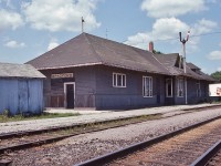 <br>
<br>
 In the heart of the Holland Marsh, the GTR built Barrie Commuter train stop  - pre GO Transit
 <br>
<br>
  at Mile 41.5 CN Newmarket Sub., Bradford, July 4, 1982 Kodachrome by S.Danko
<br>
<br>
 what's interesting:
<br>
<br>
  the Barrie Commuter train survived the  1981  VIA Rail service cuts * ( that eliminated 20% of VIA network) , the VIA replaced by the first GO train  ( Bradford as terminus) September  7 1982 (per wikipedia)   [ * the draconian 1990  VIA service cuts eliminated more than half of the VIA network  ] and the station is in GO service today.
<br>
<br>
 Perhaps the CN Bradford operator worked when deemed necessary? Traffic likely sufficient: the local freight and daily VIA & ONR trains # 1,  2, 121, 123 ( Fri Sun), 146, 147. The latter two the ex CN weekday Barrie commuters. 
<br>
<br>
  Most freight was routed on the Bala Subdivision, however I am aware that several times , the ONR pellet train operated southbound on the Newmarket – but whether this was on an exception basis is unknown
<br>
<br>
 at far right note the fruit / veggie temperature controlled box cars. 
<br>
<br>
  more Bradford
<br>
  <br>
<br>
<a href="http://www.railpictures.ca/?attachment_id= 7292">  VIA 9 with CP Rail   </a>
<br>
<br>
