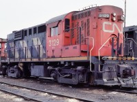 <br>
<br>
 CN #3129 was one of thirty 'high speed'  RS-18  built by MLW  1959    
<br>
<br>
 Equipped with 80 mph geared trucks the 3100's were regularly used in passenger service
<br>
<br>
 The high short hood contained the dynamic braking grids. 
<br>
<br>
 Most 3100's off the roster by 1991,  Trackside Guide shows 3124 & 3127 sold to Lackawanna Valley
<br>
<br>
 At Mac Yard March 8, 1981 Kodachrome by S.Danko
  <br>
<br>
<a href="http://www.railpictures.ca/?attachment_id= 35318">  3100's in VIA service   </a>
<br>
<br>

