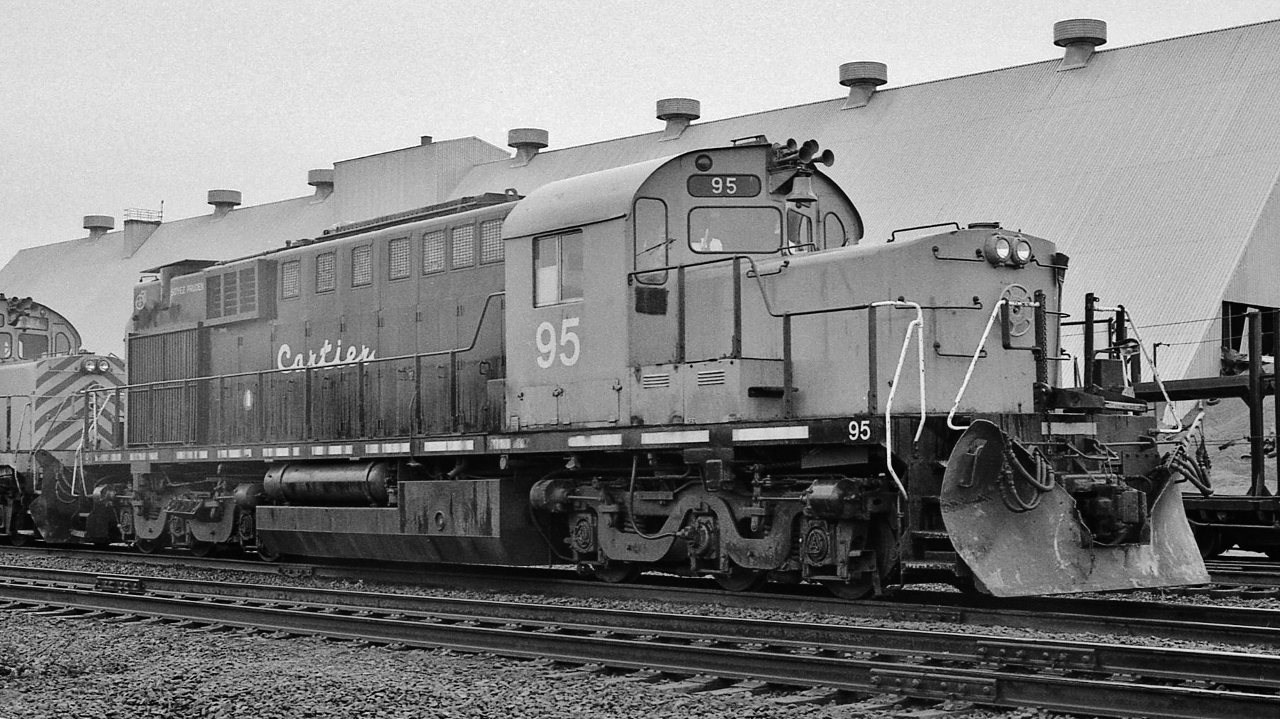 ALCOphiles' wonderland !


  Like a 'best kept secret' – well, not really a secret but quite the trek to get there


  All of CART's six first generation  ALCO RSD-15's  – built with the  251B engine - were lined up by the QC shop


  In the rain at Port Cartier P.Q.,  June 7, 1981  Kodak Tri X by S.Danko


  what's interesting


  Cartier #95 ( #94 at left ) two of six ALCO RSD-15, all acquired from B&LE, built 1959 for DM&IR, alas, all off the roster by 1991