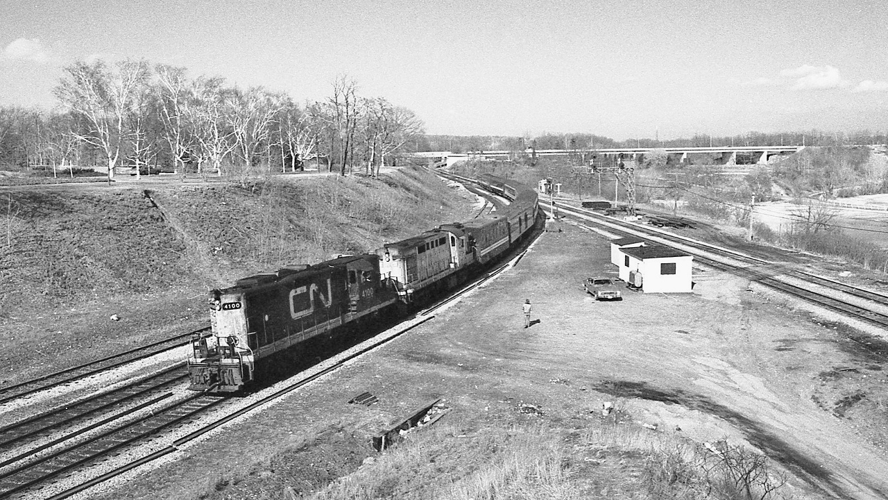Bayview Junction, from a 'true' 28mm perspective


  This photo started at Toronto Camera ( Yonge Street near Gould ) pre-owned counter...where I found a nearly new Nikkor 28mm f2.8


 CN geep #4100  /  RS-18m #3154 ( with a wave from the head end brakeman)  leads VIA CN #75 at Bayview, March 18, 1978 Kodak Tri X negative by S.Danko


  what's interesting: no one I knew bought new Nikon / Nikkor camera equipment, lenses were $459 up while quality used Nikkor were $279 or so and up, this was 1978, equivalent prices today's dollars:  $1,808.  and  $1,099,  just for the lens !


  Unknown who the Ford Maverick owner is.  My '77 Chev Impala top left. 


  sdfourty