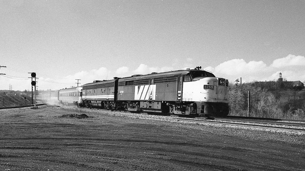 one of two of a kind – times two


  one of two MLW FPA-2u's on the roster, 6759 rebuilt 1958 – replacing the 244 engine for a 251 – renumbered from 6751 ( FPA-2 built 1955)


  one of two ex Reading Crusader round end observation – coach on the roster, of CN Champlain train fame


  that FPA-2u is eighteen years junior to that 1937 built Crusader observation - coach


  VIA CN train #76 powered by 6759 – 6620 at Hamilton West Junction, January 17, 1978  Kodak Tri X negative by S. Danko


   what's interesting


 the five car Budd built all stainless steel Reading Crusader train, two round end observation – coach, two coach, one tavern – restaurant plied the Reading Company's New York Liberty Street station to Philadelphia Reading Terminal from 1937 to 1962,


 CN bought the train set in 1962 and after refurbishment introduced the Champlain Train dedicated to the Montreal – Quebec City service. By the seventies the train set was broken up with the coaches and obs cars frequently on the Windsor trains.  By 1990 VIA retired the cars. The obs cars survive, one at the Strasburg rail museum the other is privately owned.


  Those Crusader cars are 14 years older than the building in the photo's upper right, the Sisters of St. Joseph convent constructed 1951 and sold in 2020 to a private school.  


more Hamilton West
  

   CN 4585