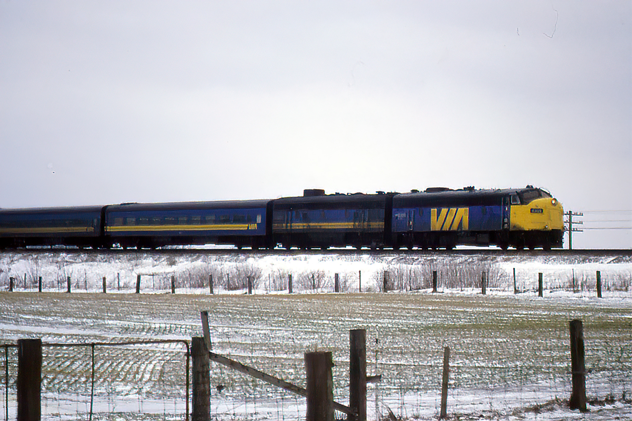 Another one from the vault....6528 and an unknown F9B charge east from Komoka after hooping their fresh orders on a grey winter morning.