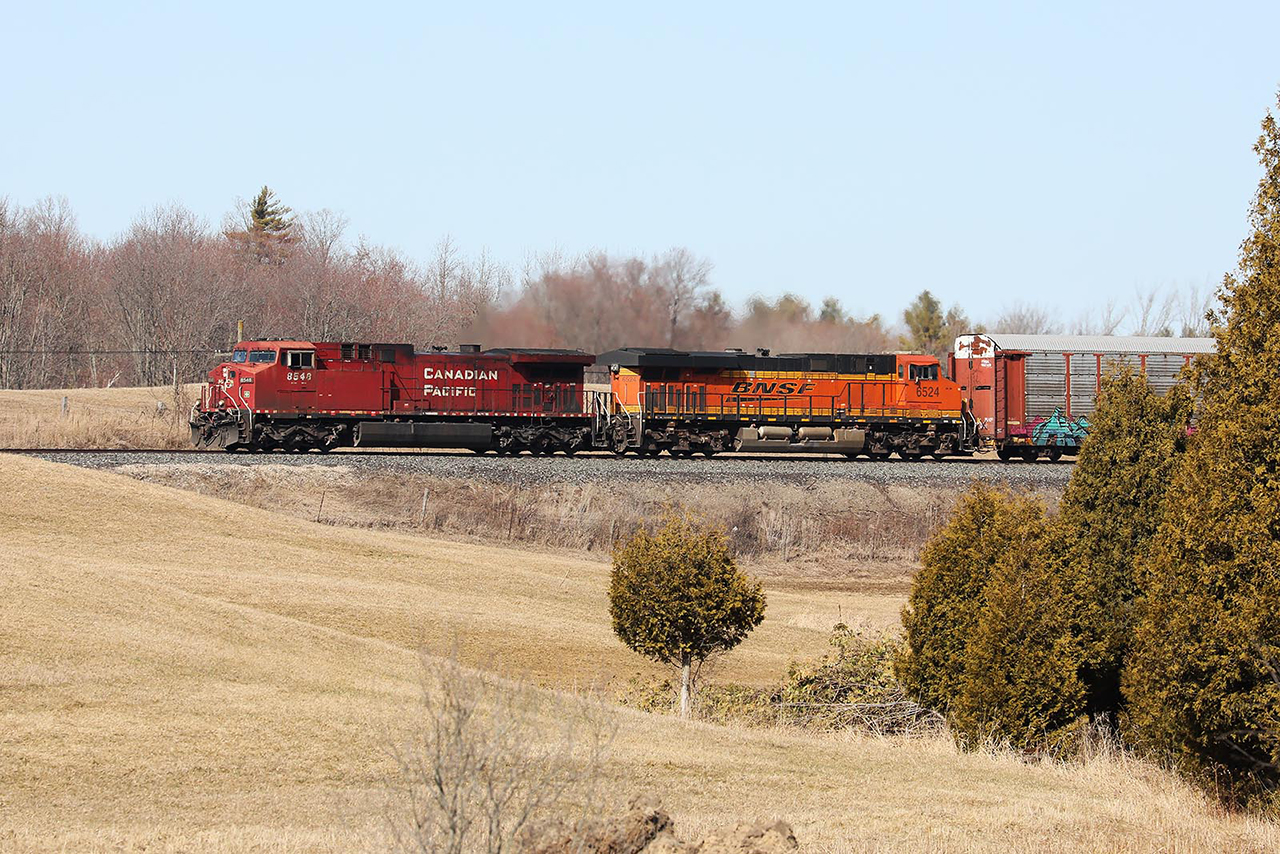 The rare has become the regular as, once again, a BNSF unit trails on 147 east of Cambridge