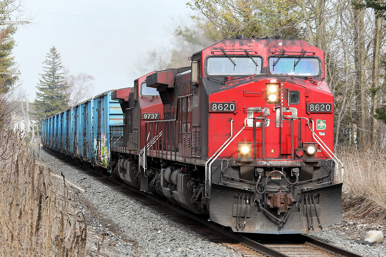 It seems really odd to see a string of boxcars on anything CP runs these days. It's a block of re-lettered CMQ boxes ahead of the empty ethanol tanks going back for another load. Nice to see that CP is adding black highlights to their power in honour of the KCS purchase.