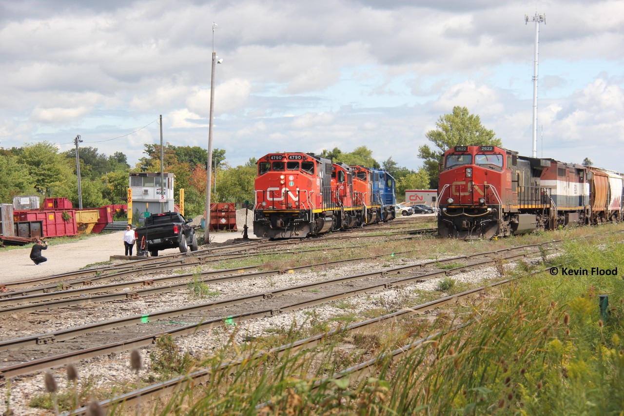 Power for CN 540 rests in the Kitchener yard, as an outlawed A431 with a CN C44-9W and a BCOL C40-8M (becoming train 568 if I recall correctly) begins to get going, preparing their train. The action proved to be a cool backdrop for someone's photograph.