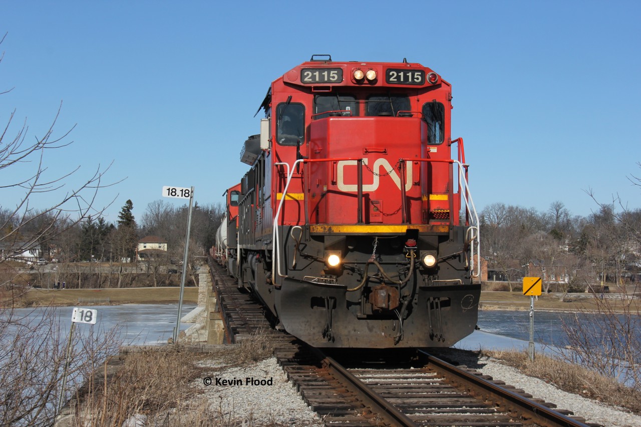 CN A402 is crawling over the Grand River at Caledonia with CN 2115-5647 for power.
