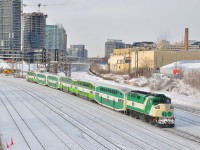 Gentrification continues reaching skyward in the big smoke, and after bringing another bunch of commuters into town GO 560 shoves it's empty consist westward from beneath the <a href=http://www.railpictures.ca/?attachment_id=2165>Bathurst Street bridge</a> leaving the USRC behind for a rest at Willowbrook.  About an hour earlier the junction laid fully in the shadows of one of the many condos surrounding the area.