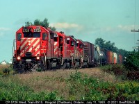 CP SD40-2 #5728 leads SD40 5553 and 2 SOO Line SD40-2's on westbound train #515 as it rolls through Kent County just west of Chatham, Ontario near Ringold on July 11, 1993.