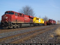 CP 8901 west, Train #235, with EMDX 7205 trailing, meets a light power T29 with CP 7048 leading CP 9777 at Walkerville (Windsor), Ontario on March 8, 2021.  T29 will depart once 235 clears with a clearance from Begin/End CTC Windsor to B/E CTC London.  Great gig if you can get it......   :-)