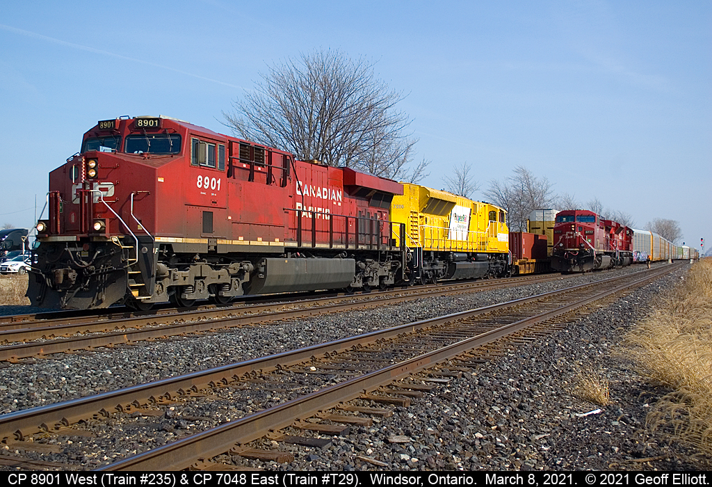 CP 8901 west, Train #235, with EMDX 7205 trailing, meets a light power T29 with CP 7048 leading CP 9777 at Walkerville (Windsor), Ontario on March 8, 2021.  T29 will depart once 235 clears with a clearance from Begin/End CTC Windsor to B/E CTC London.  Great gig if you can get it......   :-)