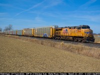 Union Pacific 7848, running solo, leads a massive empty autorack train, CP Train #244, as it rolls past the westbound Belle River Mileboard on March 22, 2021. 