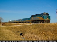 VIA 6401 leads the charge of train #72 as it crosses a private farm crossing at MP 83.46 of the VIA Chatham Subdivision on a beautiful March 22nd, 2021.