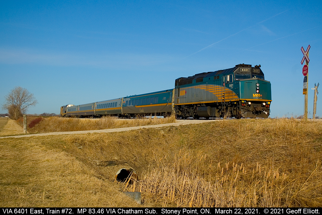 VIA 6401 leads the charge of train #72 as it crosses a private farm crossing at MP 83.46 of the VIA Chatham Subdivision on a beautiful March 22nd, 2021.