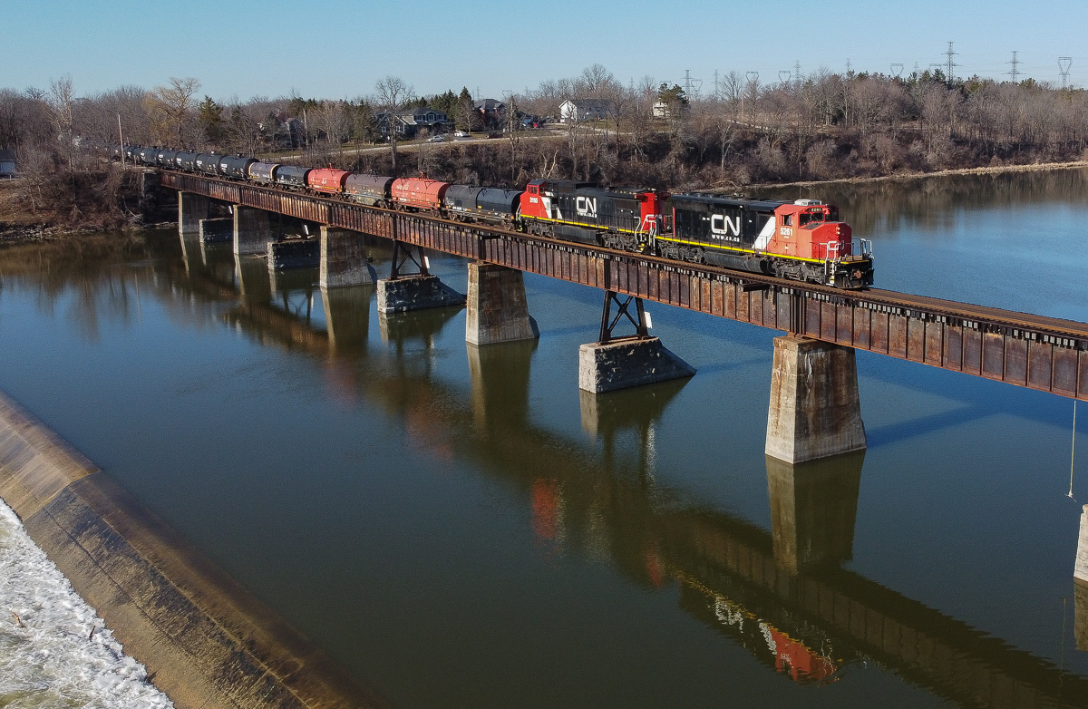 CN A401 trundles across the Grand River in Caledonia with CN 5261 leading the way.  The train was running later than usual which offered a seldom photographed Northbound run on the Hagersville Subdivision, a nice Saturday morning treat.