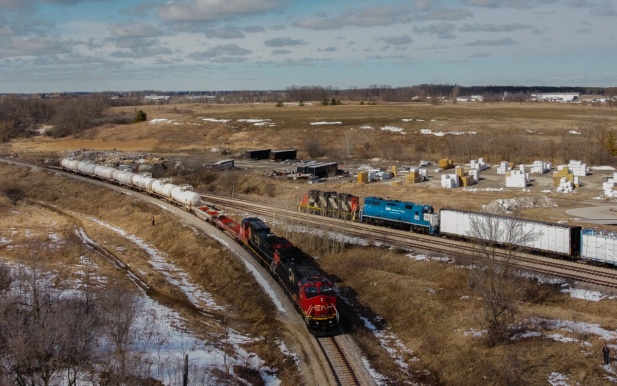 CN A40231-06 meets CN L58031-06 at Caledonia on a sunny yet cold March afternoon.  580 had run to CGC earlier in the day to lift 15 loaded centre beams from the plant and was sitting in the clear on the old Rymal Spur to meet 402 with a small 9 car train.  This is probably the first meet on the line since CN last held control of it.