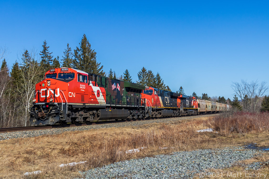 Finally was able to nab one of the repaints on the point. CN 3233 leads a 73-car potash train 594, as they head by Passekeag, destined for Saint John, New Brunswick on a beautiful Saturday afternoon.