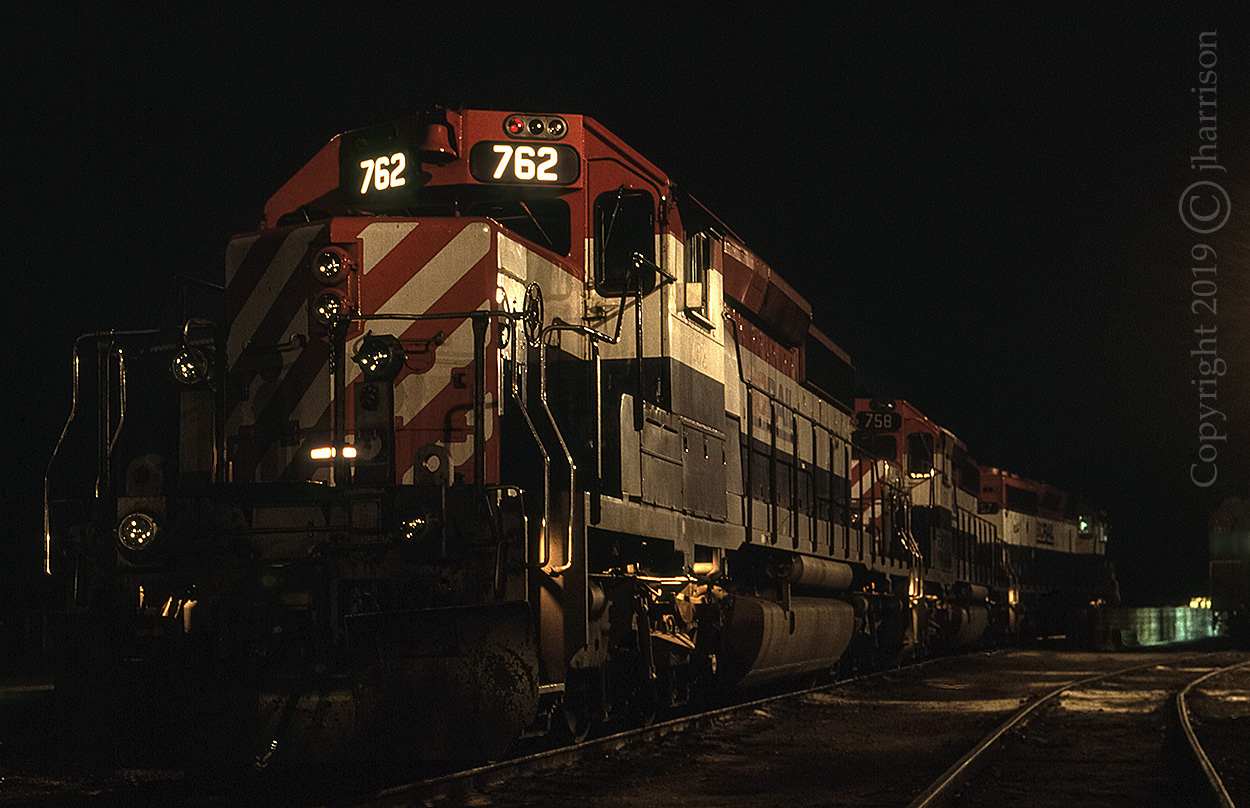 Three SD40-2s, BCR 762 758 and 757 are in the yard at Lillooet. It's hard to believe we could wander around as freely as we did back then.