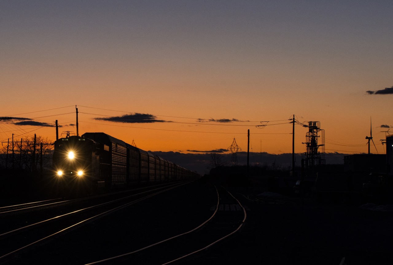 After a uneventful day where trains and the sun wouldn't cooperate, I heard over the scanner of a CP 140 in the area. Originally planning to head East for a sunset shot, I heard over the scanner of another Eastbound right on 140's tail. With a quick spin I made my way back West to Tilbury. In Tilbury the tracks curve from East/West to Northeast/Southwest. With this being the case I knew that if I could make it West of the curve the tracks and sunset would line up better. Here we see CP 2-244 hot on the tail of 140 rolling through Tilbury, a few hundred feet behind me is where they would lean into the curve following the geography of Southern Ontario.