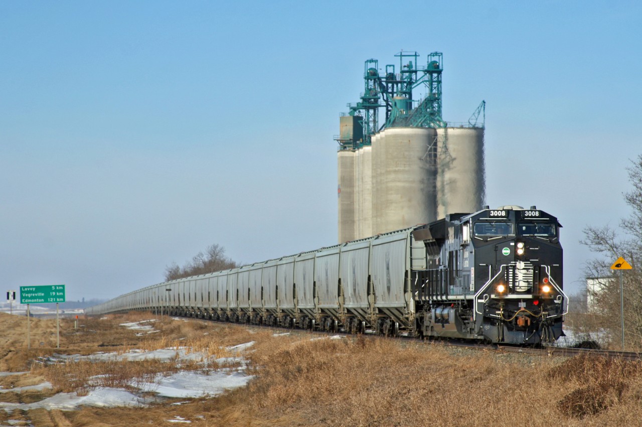 Edmonton to Gladstone train G 80650 05 rolls pass the Richardson Pioneer Elevator just east of Lavoy, Alberta.