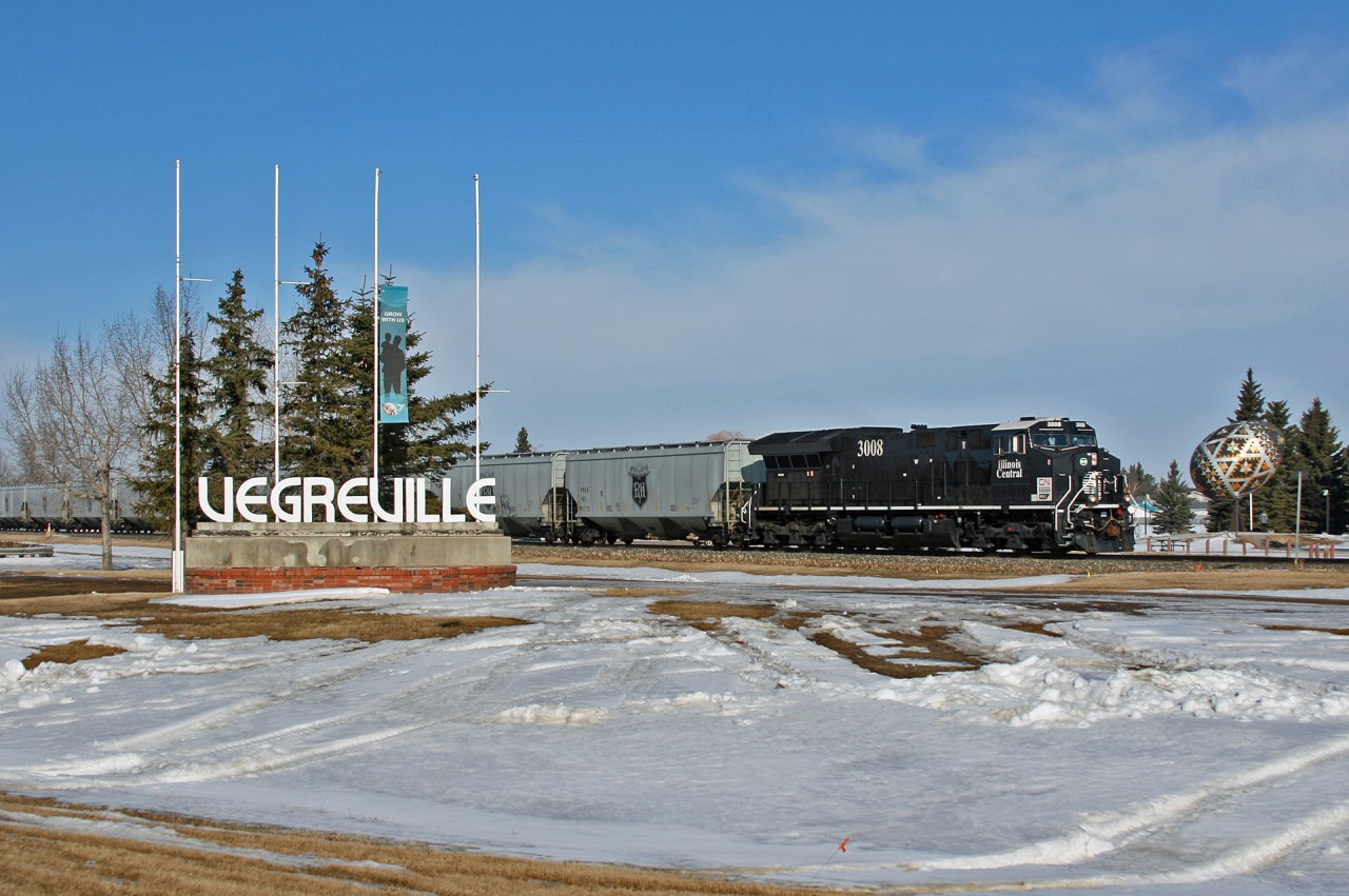 Welcome to Vegreville, Alberta; home of the Worlds Largest Pysanka Egg.  G 80650 05 has just met 411 at Vegreville, and pulls east towards a crew change at Vermillion, Alberta.  G 80650 05 is handling 106 empty grain cars bound for Gladstone, Manitoba and will traverse a majority of the Prairie North Line (PNL) to get there.