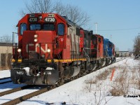 CN L568 has just taken the power off the previous nights L566 at the east end of the yard and is approaching St. Leger Street and the cross-overs, where they would reverse and back into the Kitchener yard. L566 had to bring a timed-out train off the Waterloo Spur then head west to Stratford to retrieve the previous day’s L568 whose crew had also run out of time. The result was a consist that included 4730, 7081, 4789, GMTX 2284 and 7080. March 7, 2020.