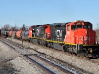 A rather late A40131 20 makes their way through Hagersville with CN 5261 and CN 2195 in charge of their 21 car train. 5261 was one of two SD40-2W's (5258) converted for experimental Natural Gas operations in the early 2010's