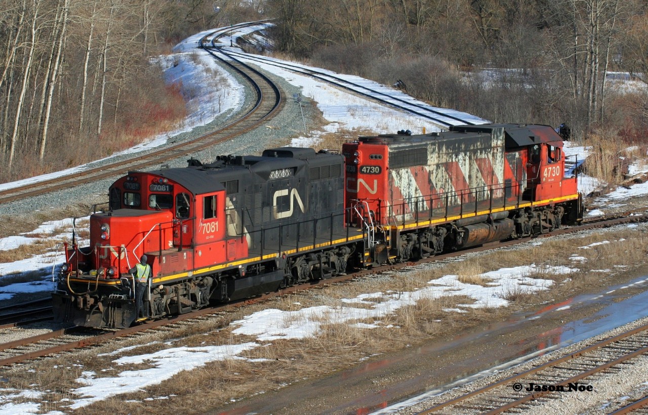 CN L540 with 4730 and 7081 are working the Kitchener interchange with Canadian Pacific. They have just set-off 10 cars and will then have several tracks to lift before shoving back to the yard on the Huron Park Spur. March 8, 2020.