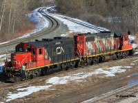 CN L540 with 4730 and 7081 are working the Kitchener interchange with Canadian Pacific. They have just set-off 10 cars and will then have several tracks to lift before shoving back to the yard on the Huron Park Spur. March 8, 2020.

