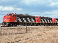 First place I set up, clouds. Drove for a second try and got lucky. They have 35 loaded sulphur hoppers behind the units and it won't be much longer till Calder and on the shop track. Photo taken just west of Redwater.