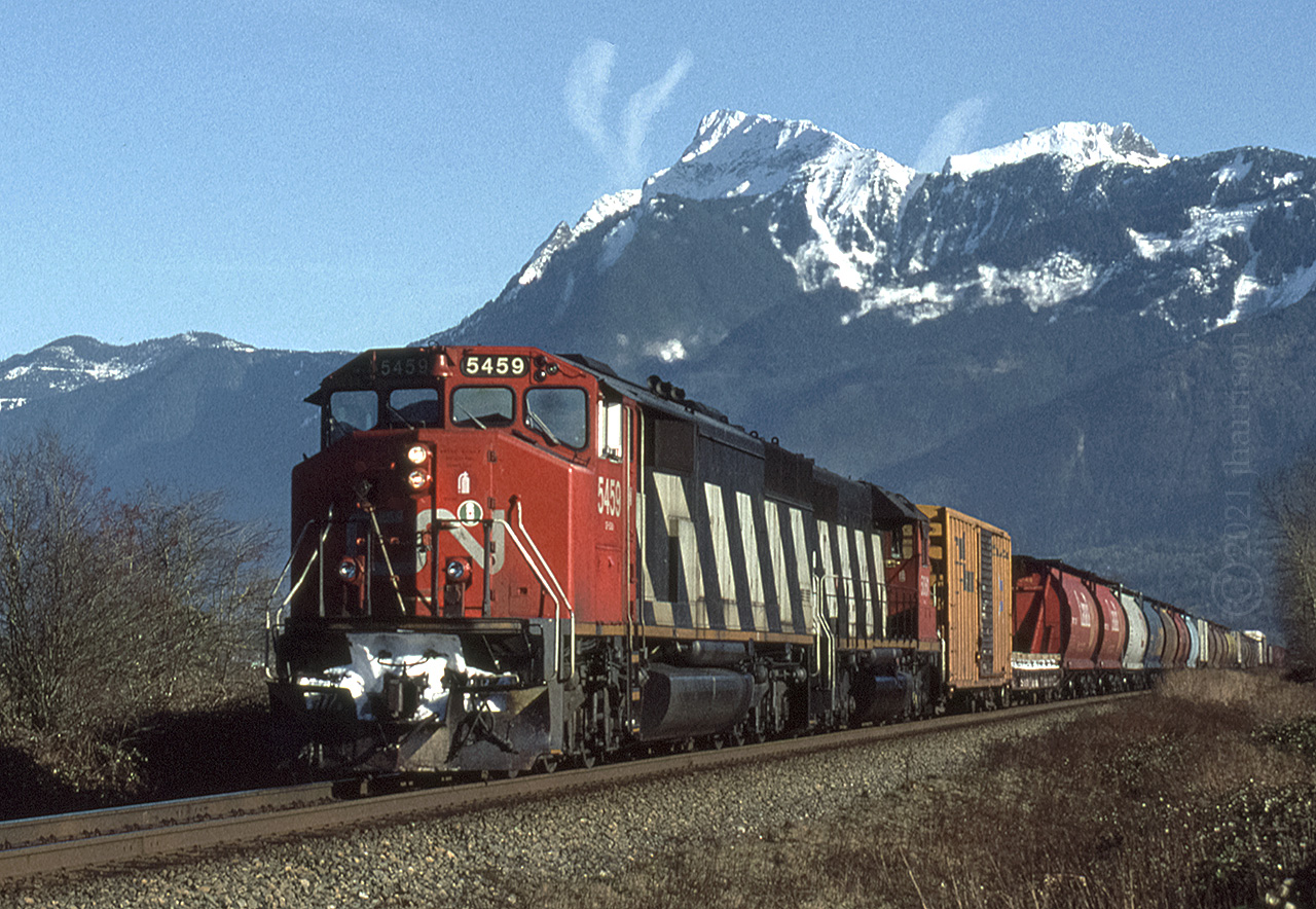 CN SD-60 5459 with the SD-40 5061 trailing are traveling through Rosedale as they approach Chilliwack. 7000 ft. Mount Cheam looms in the background. GPS is approximate.