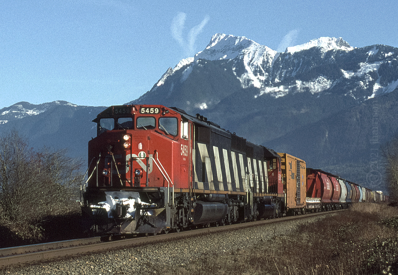 CN SD-60 5459 with the SD-40 5061 trailing are traveling through Rosedale as they approach Chilliwack. 7000 ft. Mount Cheam looms in the background. GPS is approximate.