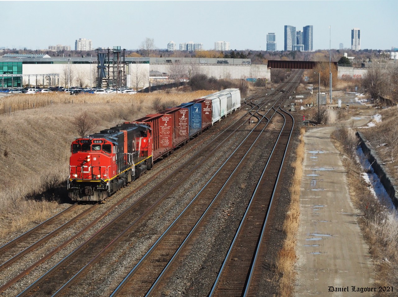 CN local 545 enroute to the MacMillan yard after coming off the Newmarket Subdivision which overpasses the CN York subdivision in the background.